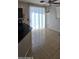 Bright dining area features tile flooring, sliding doors to the patio, and a ceiling fan at 5311 W Fulton St, Phoenix, AZ 85043