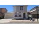 Two-story home featuring neutral stucco, a two-car garage, and a well-maintained front yard in a residential neighborhood at 5311 W Fulton St, Phoenix, AZ 85043