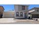 Charming two-story home featuring neutral stucco, a two-car garage, and a well-maintained front yard in a neighborhood at 5311 W Fulton St, Phoenix, AZ 85043