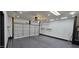 Well-lit garage with epoxy flooring and an automatic door, providing secure parking and ample space at 5311 W Fulton St, Phoenix, AZ 85043