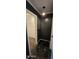 Dark hallway with dark tiling leading to walk-in closet at 5311 W Fulton St, Phoenix, AZ 85043