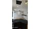 Stylish kitchen with dark cabinets, granite counters, and sleek black bar at 5311 W Fulton St, Phoenix, AZ 85043