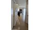 View of the black granite counter kitchen with tile flooring from the hallway at 5311 W Fulton St, Phoenix, AZ 85043