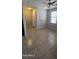 Open living room features neutral paint, tile flooring, and stairs to the second floor at 5311 W Fulton St, Phoenix, AZ 85043