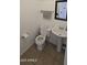 Small powder room with a pedestal sink and tile flooring at 5311 W Fulton St, Phoenix, AZ 85043