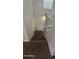 Carpeted staircase descending to the lower level with white painted walls at 5311 W Fulton St, Phoenix, AZ 85043