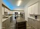 Modern kitchen featuring white cabinets, stainless steel appliances and an island at 555 N May -- # 1, Mesa, AZ 85201
