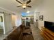 Bright living space with a ceiling fan and an open flow into the updated kitchen at 555 N May -- # 1, Mesa, AZ 85201