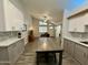 Bright living room featuring vaulted ceilings, updated cabinets, and an open floorplan at 555 N May -- # 1, Mesa, AZ 85201