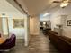 Open-concept living area with wood flooring, modern lighting, and slider to dining room at 555 N May -- # 1, Mesa, AZ 85201