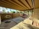 Covered patio featuring a decorative brick wall, concrete floor, and view of the neighborhood at 555 N May -- # 1, Mesa, AZ 85201