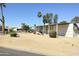 Single-story home featuring neutral siding, a covered entry, and mature landscaping in a well-maintained community at 649 S 87Th Way, Mesa, AZ 85208