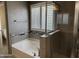 Bathroom with tub, tiled shower, silver wallpaper and shutters at 6506 S 50Th Ln, Laveen, AZ 85339