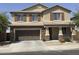 Charming two-story home with a two car garage, stone accents and a well maintained front yard at 6506 S 50Th Ln, Laveen, AZ 85339