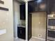Kitchen area featuring dark cabinetry, granite countertops and stainless steel appliances at 6506 S 50Th Ln, Laveen, AZ 85339