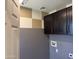 This laundry room features stylish cabinetry and modern design, perfect for efficient home management at 6506 S 50Th Ln, Laveen, AZ 85339