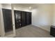 Office space with built-in shelving and wood floors at 6506 S 50Th Ln, Laveen, AZ 85339