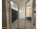 Office space with built-in shelving, wood floors and natural light at 6506 S 50Th Ln, Laveen, AZ 85339
