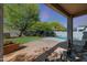 Charming backyard patio with seating area overlooking a lush garden and inviting pool at 7336 E Overlook Dr, Scottsdale, AZ 85255