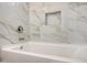Luxurious bathroom featuring a pristine tub and stylish tiled walls with a convenient in-wall niche at 7336 E Overlook Dr, Scottsdale, AZ 85255