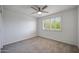 Bright bedroom featuring a ceiling fan, and a window with beautiful shutters, creating a welcoming atmosphere at 7336 E Overlook Dr, Scottsdale, AZ 85255