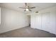 Cozy bedroom with closet providing ample storage and a ceiling fan for enhanced comfort at 7336 E Overlook Dr, Scottsdale, AZ 85255
