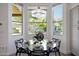 Bright breakfast nook with views of the backyard pool and desert landscape at 7336 E Overlook Dr, Scottsdale, AZ 85255