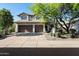 Charming two-story home with a three-car garage and desert landscaping at 7336 E Overlook Dr, Scottsdale, AZ 85255
