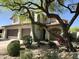 Charming two-story home featuring a two-car garage and desert landscaping at 7336 E Overlook Dr, Scottsdale, AZ 85255