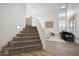 Bright foyer with high ceilings, staircase, and wood-look tile flooring at 7336 E Overlook Dr, Scottsdale, AZ 85255
