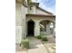 Inviting front entrance with a dark wood door, arched detailing, and desert landscaping at 7336 E Overlook Dr, Scottsdale, AZ 85255