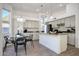 Modern kitchen with an island, granite countertops, and a dining area at 7336 E Overlook Dr, Scottsdale, AZ 85255