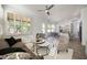 Spacious living room that features plantation shutters and an open layout to the dining area and kitchen at 7336 E Overlook Dr, Scottsdale, AZ 85255