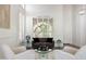 Cozy living room featuring high ceilings, a large window, and stylish decor at 7336 E Overlook Dr, Scottsdale, AZ 85255