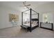 Primary bedroom featuring a four-poster bed, neutral decor, and plantation shutters to create a soothing retreat at 7336 E Overlook Dr, Scottsdale, AZ 85255