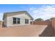 View of backyard showing an empty, enclosed space ready for landscaping or customization at 7643 W Park St, Laveen, AZ 85339