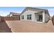 View of backyard showing an empty, enclosed space ready for landscaping or customization at 7643 W Park St, Laveen, AZ 85339
