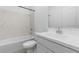 Modern bathroom featuring a sleek vanity, a soaking tub, and contemporary fixtures at 7643 W Park St, Laveen, AZ 85339