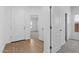 Bright entryway featuring wood-look tile and white interior doors at 7643 W Park St, Laveen, AZ 85339