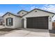 Beautiful single-story home features a two-car garage and neutral stucco at 7643 W Park St, Laveen, AZ 85339