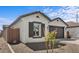 A single-story home featuring a two-car garage and neutral stucco at 7643 W Park St, Laveen, AZ 85339