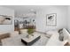 Open-concept living area with a modern kitchen, dining area, and comfortable seating arrangement at 7643 W Park St, Laveen, AZ 85339