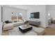 Bright living room featuring modern decor and wood-look tile at 7643 W Park St, Laveen, AZ 85339