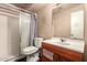 Clean bathroom featuring a tub, toilet, wood vanity, and efficient layout for everyday convenience at 801 E Oakland St, Chandler, AZ 85225