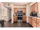 Efficient kitchen with stainless steel appliances, laminate countertops and tiled floors, perfect for cooking at 801 E Oakland St, Chandler, AZ 85225