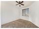 Cozy bedroom featuring neutral carpet, a ceiling fan, and a window for natural light at 809 S 120Th Ave, Avondale, AZ 85323