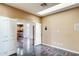 Hallway boasting sleek wood floors, open doorways to a kitchen and multiple rooms at 809 S 120Th Ave, Avondale, AZ 85323