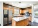 Well-equipped kitchen with stainless steel appliances, granite countertops, and a center island at 809 S 120Th Ave, Avondale, AZ 85323