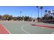 Outdoor basketball courts with well-maintained surfaces, lighting, and scenic mountain views at 9204 N 106Th Way, Scottsdale, AZ 85258