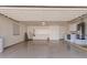 Clean and spacious garage featuring built-in cabinets and a convenient laundry area at 9204 N 106Th Way, Scottsdale, AZ 85258